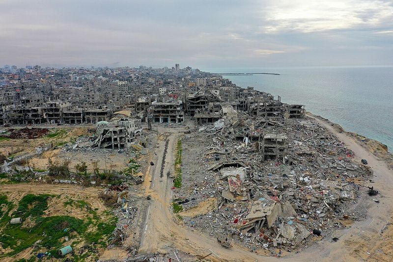 Aerial view of widespread building destruction in a Gaza refugee camp