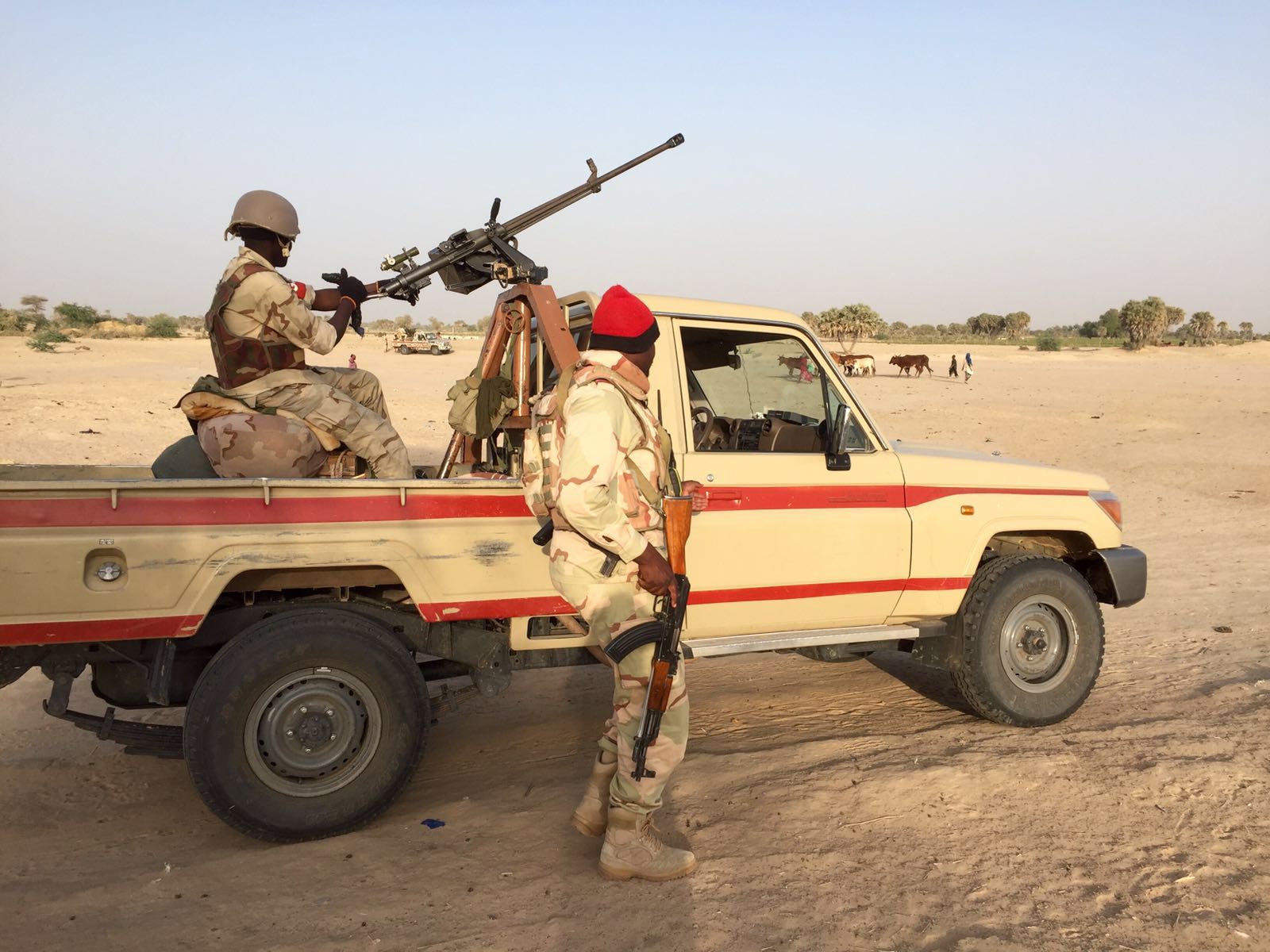 A machine gun mounted on a pickup truck (a technical)