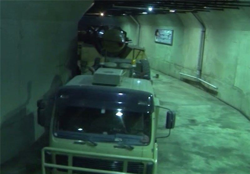 A missile transporter-erector truck negotiating a narrow underground tunnel junction